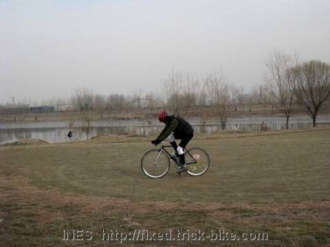 Fixie Riding on Golf Course Green
