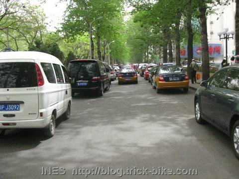 Cars parked and driving in the huge bike lane