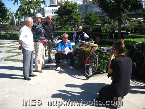Suzan filming the Beijing Bike Trick Gang