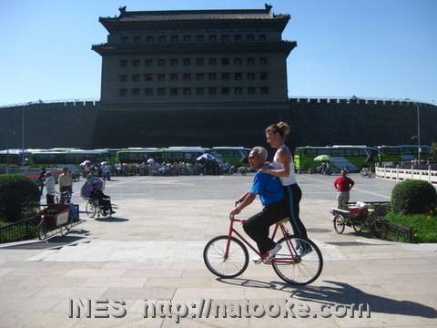 Ines and Yu on a trick bike