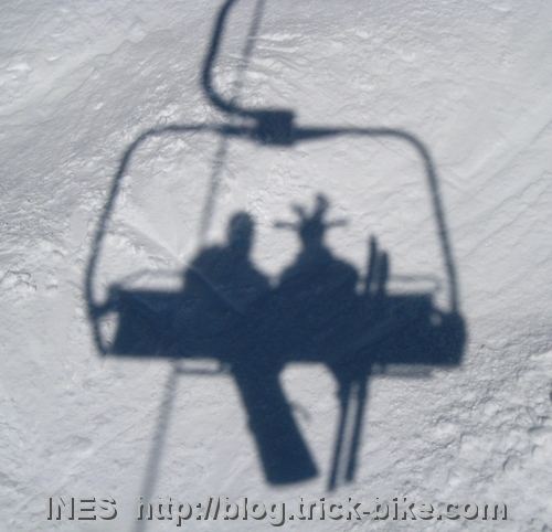 Two birds in a ski chair lift